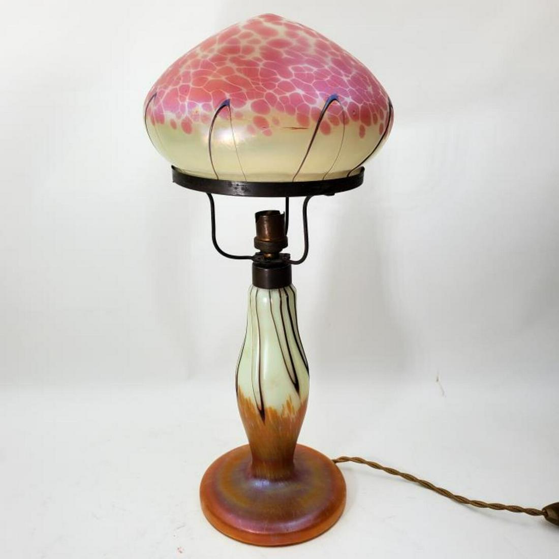 Antique Loetz Austrian Art Glass Table Lamp: Antique Loetz Austrian Art Glass Table Lamp. Circa 1910.Condition: Excellent. Minor Chips on the Fitter Rim.Dimension: Dia of Shade 7", H- 16". Provenance: From the Collection of a New Jersey Doctor. 