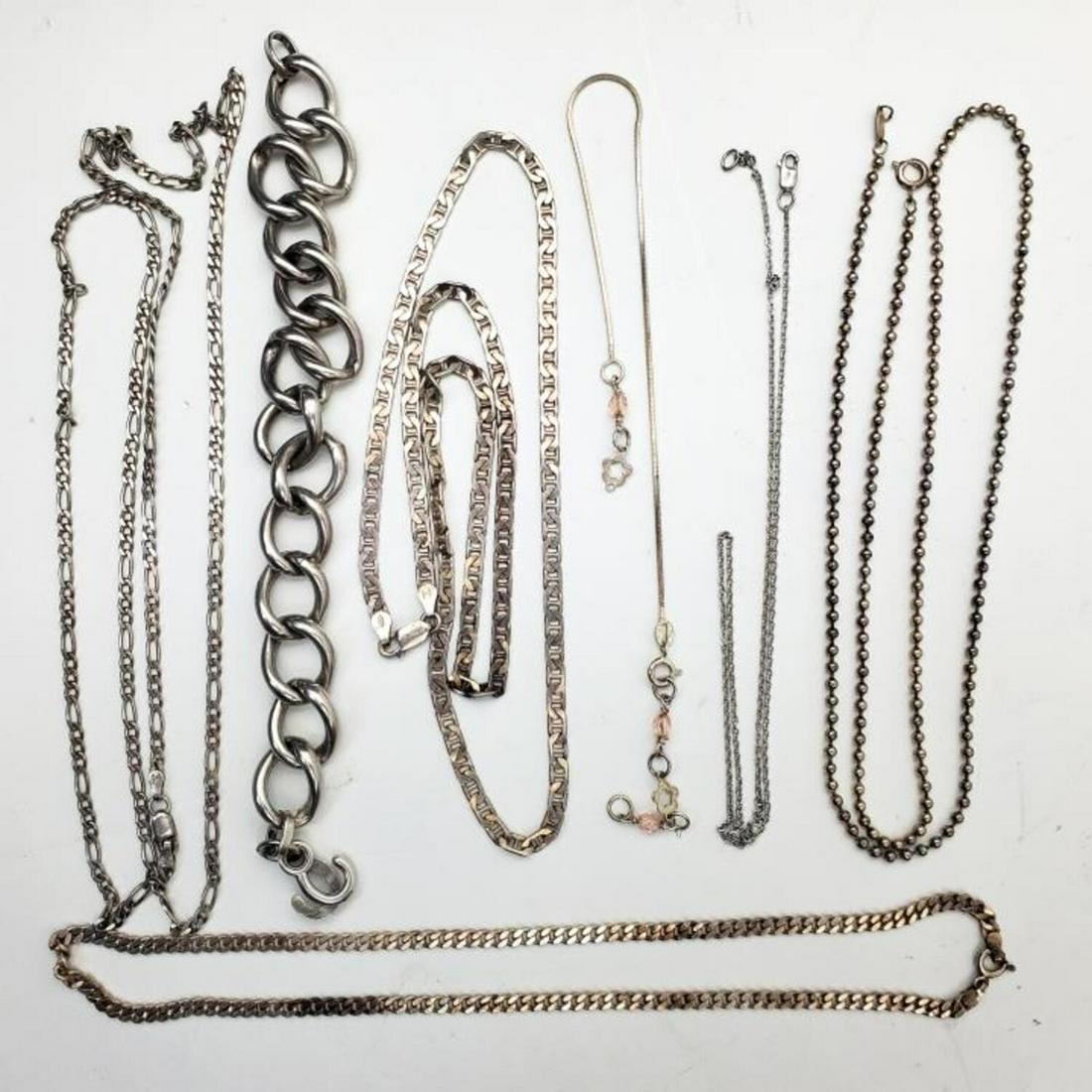 Lot of 7 Sterling Silver Chains and Bracelets: Lot of 7 Sterling Silver Chains and Bracelets. Condition: Excellent. Dimensions: Longest- 29". Weight- 2.62 ozt / 81.7 g. Provenance: From a Long Island, NY Home.Please note the absence of a condition