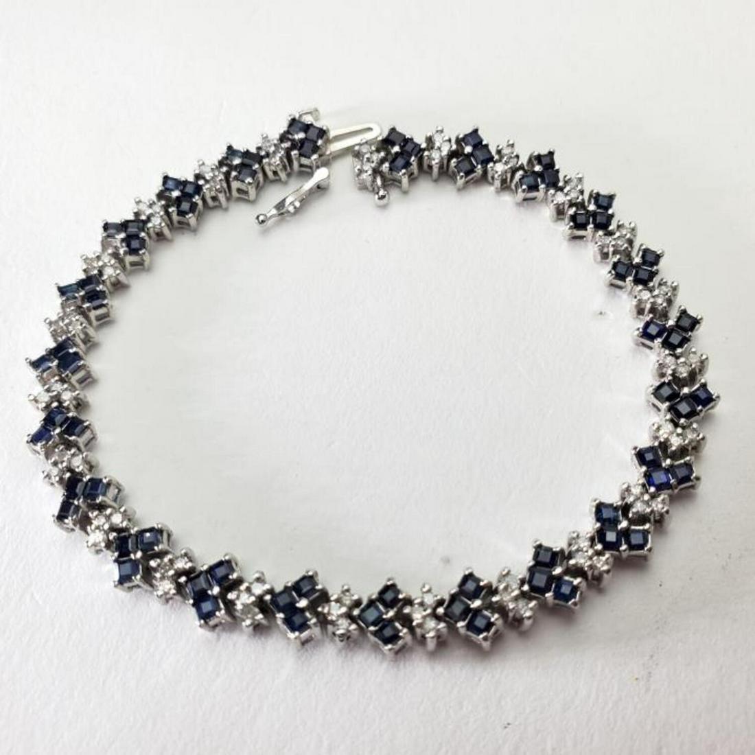 10K White Gold, Diamonds, and Sapphires Bracelet: 10K White Gold, Diamonds, and Sapphires Bracelet. Condition: Excellent. Dimension: L- 7". Weight: 6.9 dwt / 10.8 g. Provenance: From a Queens, NY Home.Please note the absence of a condition report doe