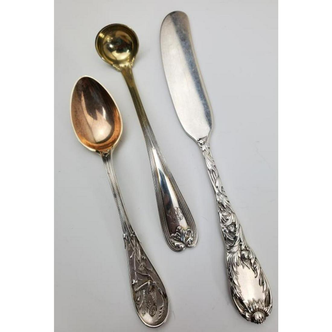 Three Tiffany & Co. Sterling Silver Items: Three Tiffany & Co. Sterling Silver Items including Chrysanthemum Butter Knife, Audubon Serving Spoon, Miniature Ladle. All Fully Hallmarked.Condition: All are Generally Good. 2 are Monogrammed.Dimens
