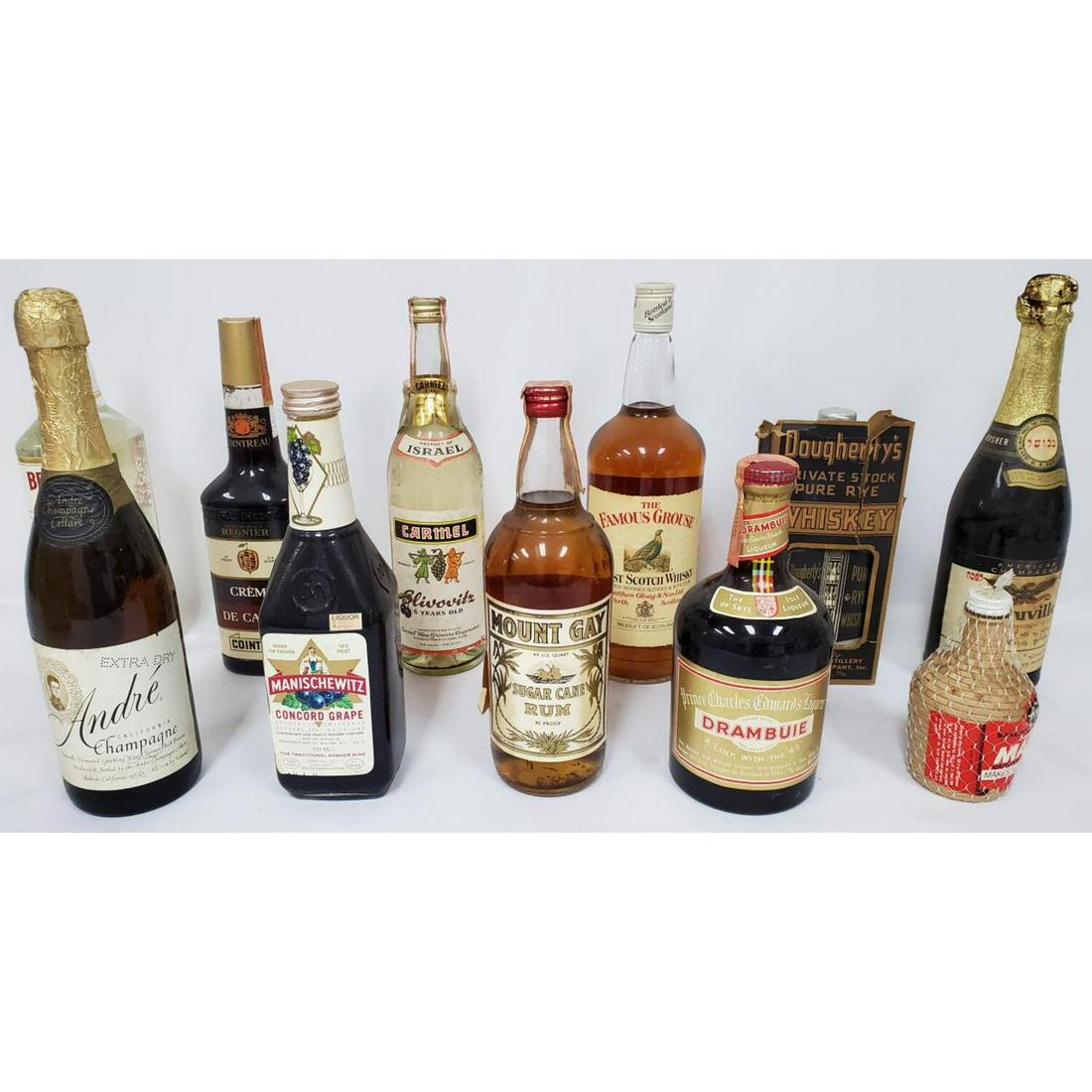 Lot of 11 Vintage and Old Liquor Bottles: Lot of 11 Vintage and Old Liquor Bottles Including Dougherty's Private Stock Pure Rye Whiskey and Others. Condition: All Unopened. As Found. Dimensions: Tallest H- 12". Provenance: From a New Jersey E