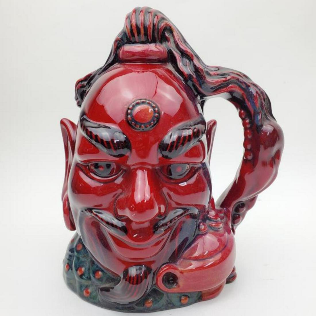 Royal Doulton Flambe "Aladdin's Genie" Large Mug: Royal Doulton Flambe "Aladdin's Genie" Large Character Mug. With Certificate of Authenticity. Condition: Excellent. Dimension: H- 7.5". Provenance: From a New Jersey Private Collector. Please note the