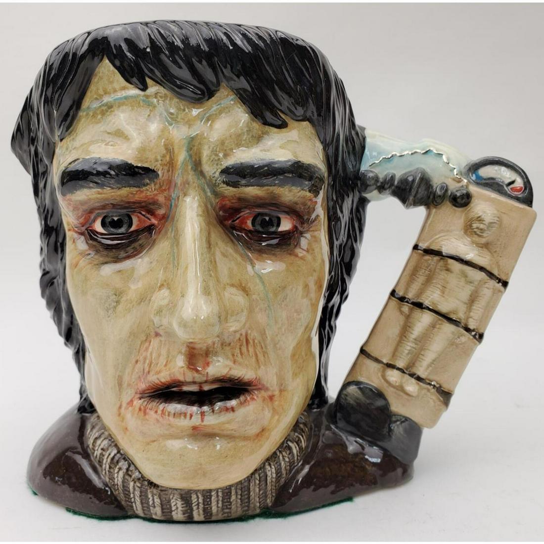 Royal Doulton "Frankenstein's Monster" Mug: Royal Doulton "Frankenstein's Monster" Character Mug. With Certificate of Authenticity. Condition: Excellent. Dimension: L- 8", H- 6.4". Provenance: From a New Jersey Private Collector. Please note th