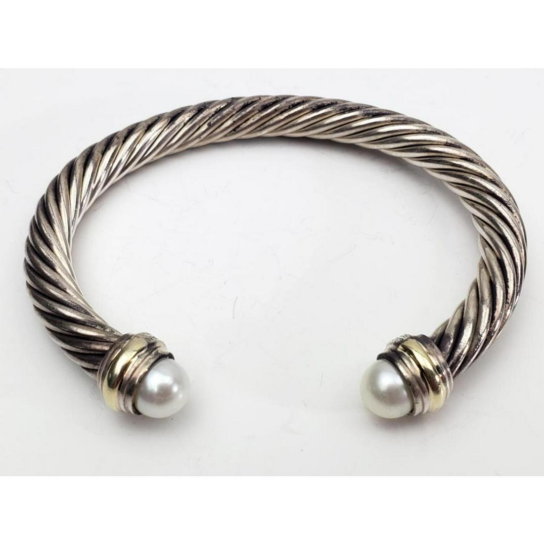 David Yurman Silver, Pearls and 14K Gold Bracelet: David Yurman - Sterling Silver, 14K Gold and Pearls Bracelet.Condition: Generally Good. Some tarnishes.Dimensions: Diameter 3". Width .25".Total Weight: 39.5 grProvenance: From a Long Island, NY Home.