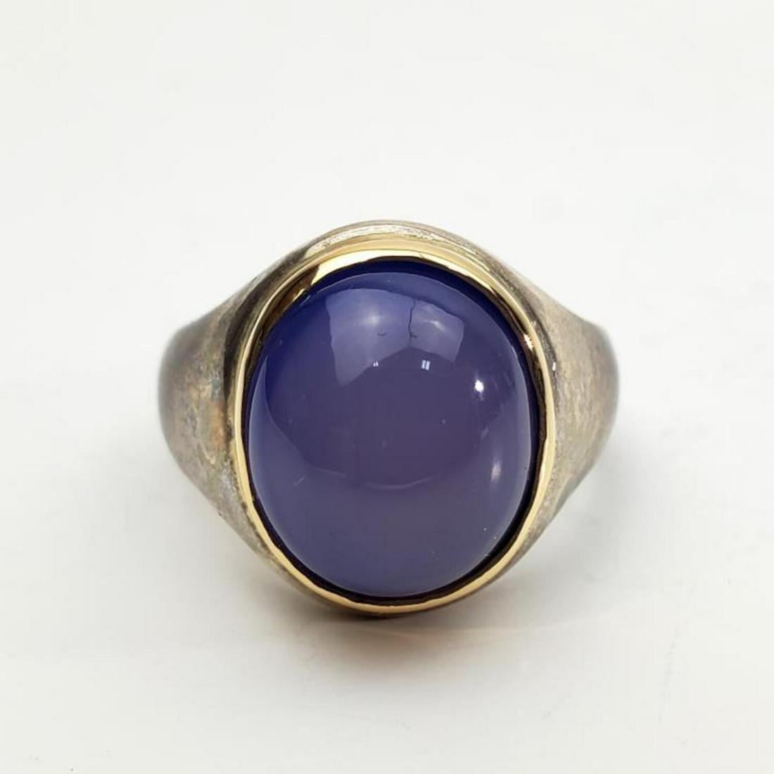 Tiffany Sterling Silver, 14K Gold Ring Chalcedony: Tiffany & Co. Sterling Silver and 14K Gold and Chalcedony Ring.Condition: Generally Good. Faded.Dimensions: Size of ring 8.25".Total Weight: 12.8 gr.Provenance: From a Long Island, NY Home.Please note