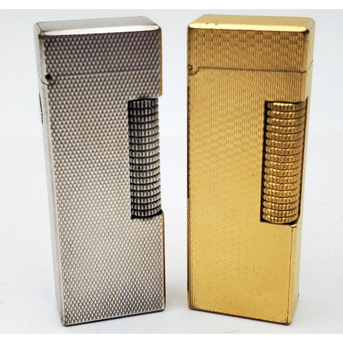 2 Dunhill Lighters with Original Boxes: 2 Dunhill Lighters with Original Boxes. Condition: Generally Very Good. Dimensions: Provenance: From a Long Island, NY Home. Please note the absence of a condition report does not imply that there are