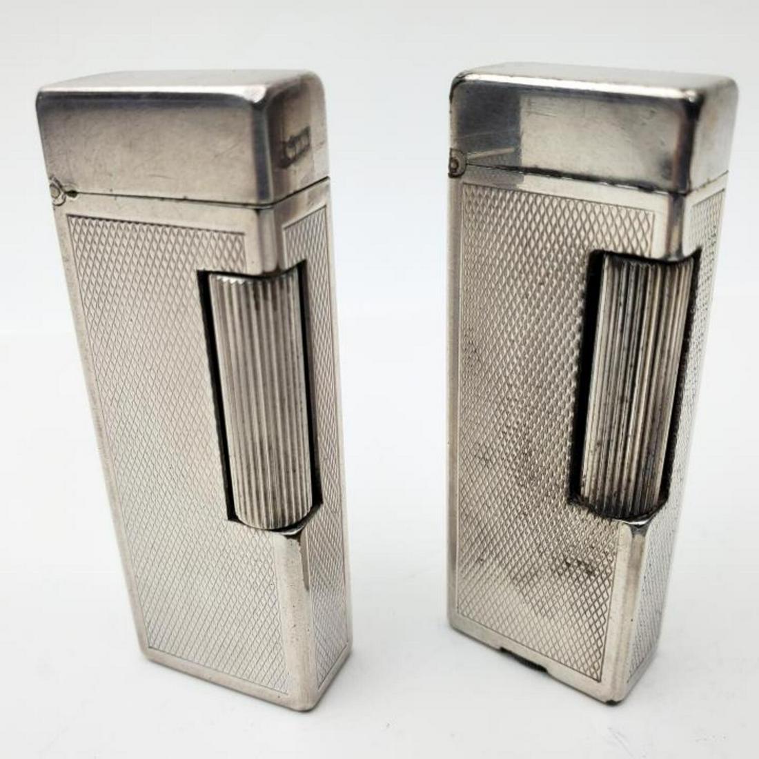 2 Vintage Dunhill Rollalite Lighters: 2 Vintage Dunhill Rollalite Lighters. Condition: Generally Good. As Is. Dimensions: Provenance: From a Long Island, NY Home. Please note the absence of a condition report does not imply that there are