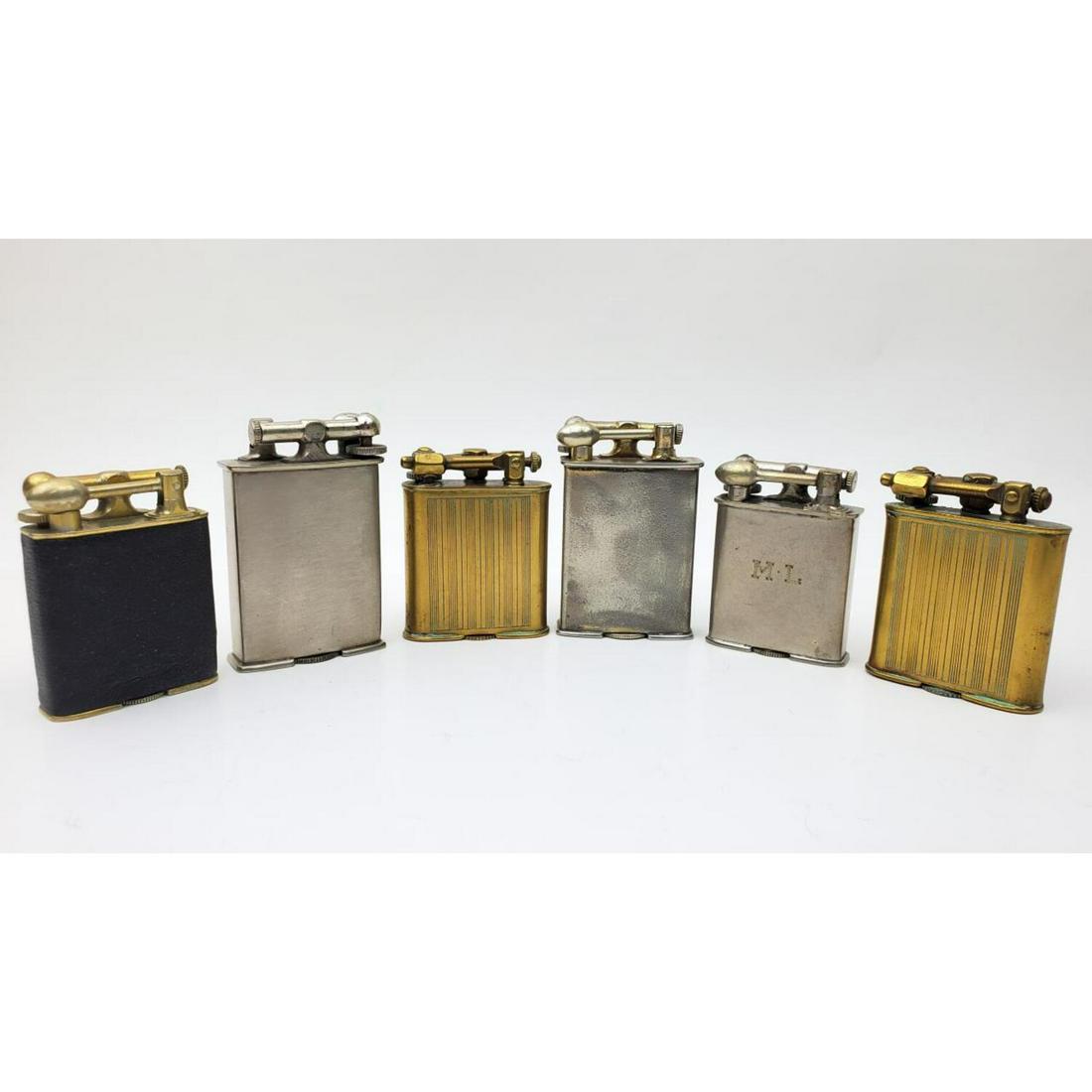 6 Lighters Including Park Sherman and Clark: Lot of 6 Lighters Including 2 18K Gold Plated Park Sherman Lighters, 2 18K Gold Plated Clark Lighters, and 2 Platinum Plated Clark Lighters. Condition: Generally Good. As Is. One is Monogrammed. Dimen
