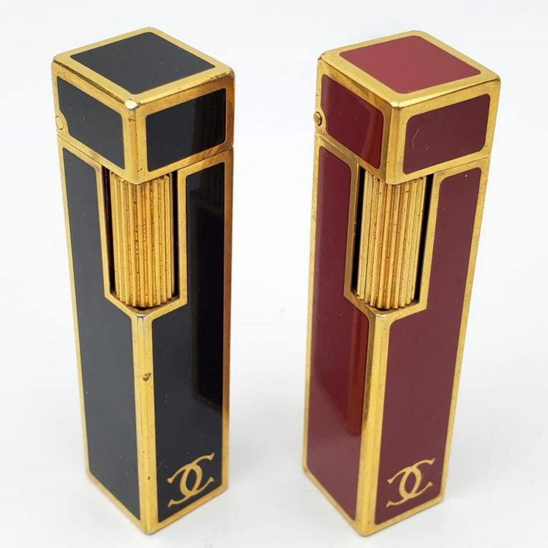 2 Vintage Cartier Lighters w/ 18K Gold Trim: 2 Vintage Cartier Designer Chanel Lighters with 18K Gold Trim. Fully Marked. Condition: Generally Very Good. As Is. Dimensions: 2.5". Provenance: From an Estate of a Collector in Long Island, NY. Plea