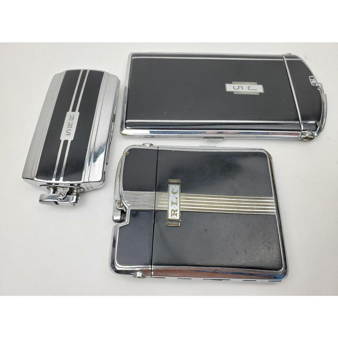 Lot of 3 Vintage Cigarette Case Lighters: Lot of 3 Vintage Cigarette Case Lighters, Including " Ten-A-Case" and "Magnacase". Condition: Generally Good. As Is. All Monogrammed. Dimensions: Largest- 6" x 3.25". Provenance: From an Estate of a C