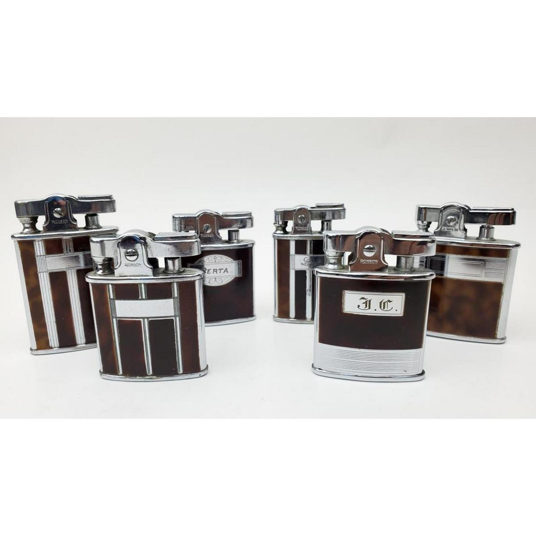 6 Vintage Ronson Enamel Cigarette Lighters: Lot of 6 Vintage Ronson Enamel Cigarette Lighters. Condition: Generally Very Good. As Is. 3 are Monogrammed. Dimensions: Various Sizes. Provenance: From an Estate of a Collector in Long Island, NY. Pl