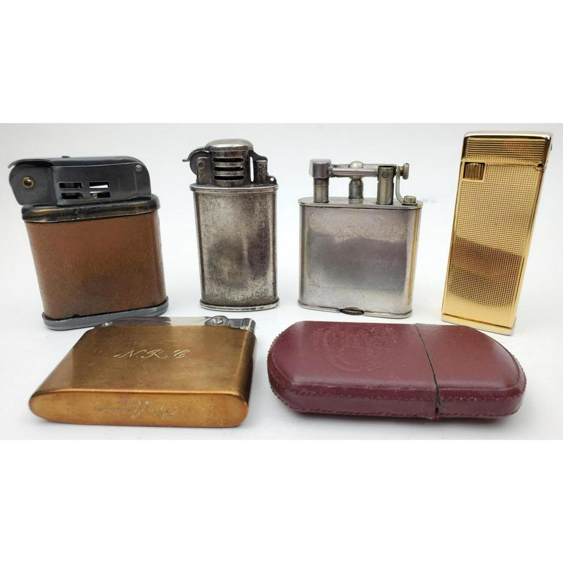 Lot of 6 Cigarette Lighters: Lot of 6 Cigarette Lighters Including Dunhill, Elgin American, and Others. One has a Leather Case. Condition: Generally Good. As Is. One is Monogrammed. Dimensions: Various Sizes. Provenance: From an