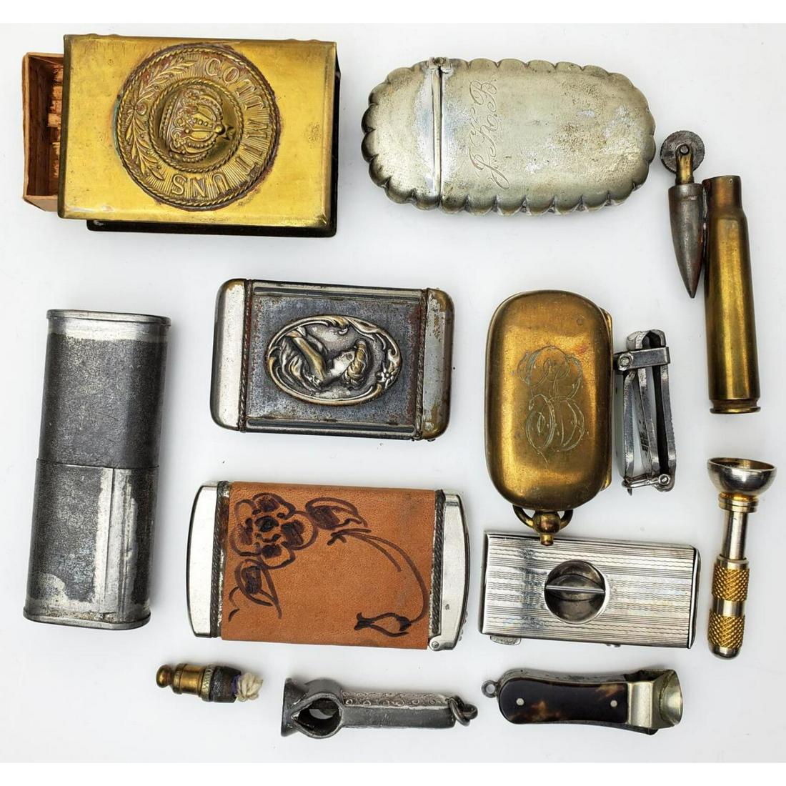 Lot of Metal Items: Lot of Metal Items Including Match Holders, Cigarette Cutters, and Cartridge Lighter. Condition: Generally Good. As Is. Dimensions: Various Sizes. Provenance: From an Estate of a Collector in Long Isl