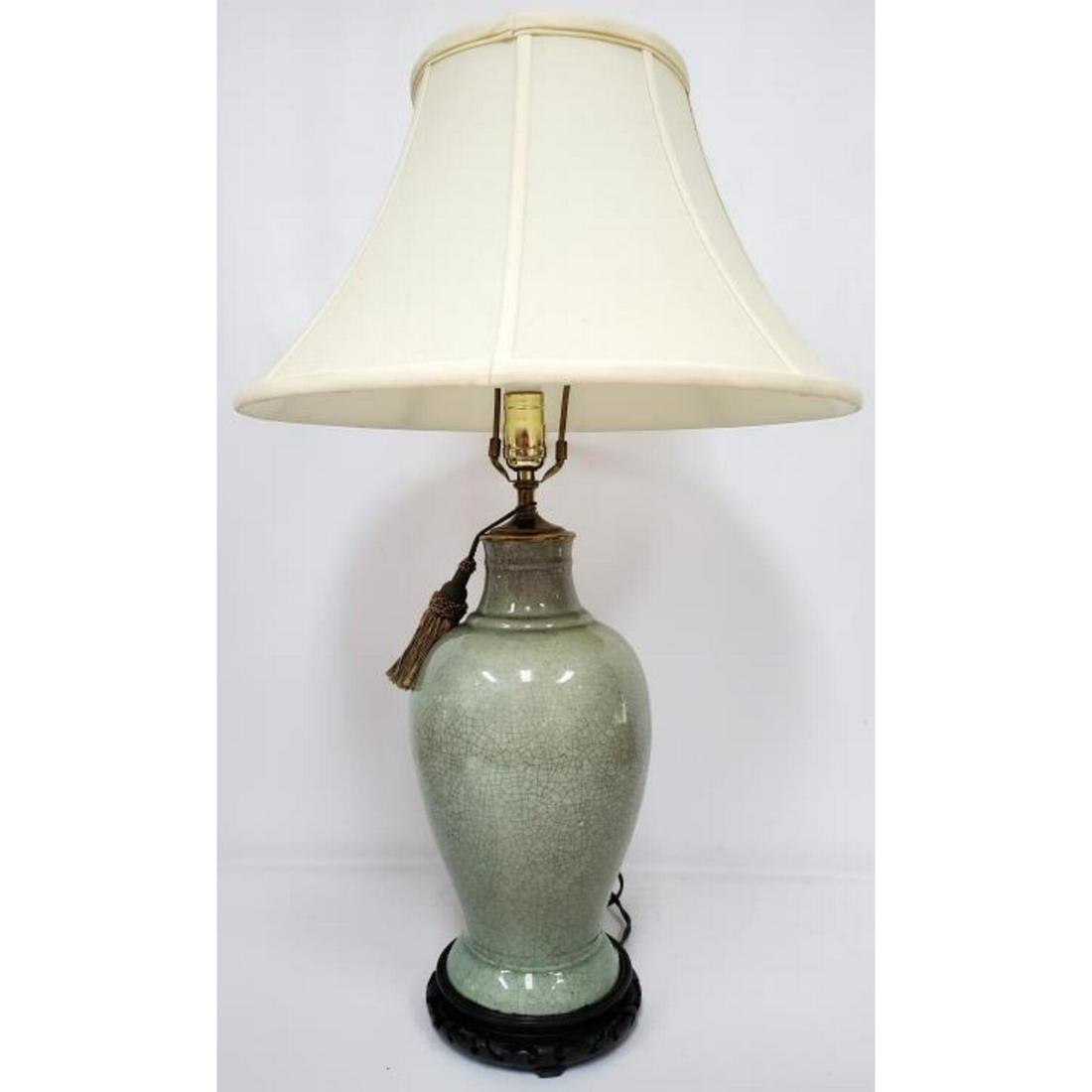 Chinese Large Celadon Glazed Lamp, Original Base: Chinese Large Celadon Glazed Lamp with Original Base.Condition: Generally Good.Dimensions: Total H- 28".Provenance: From a Queens, NY Home.Please note the absence of a condition report does not imply