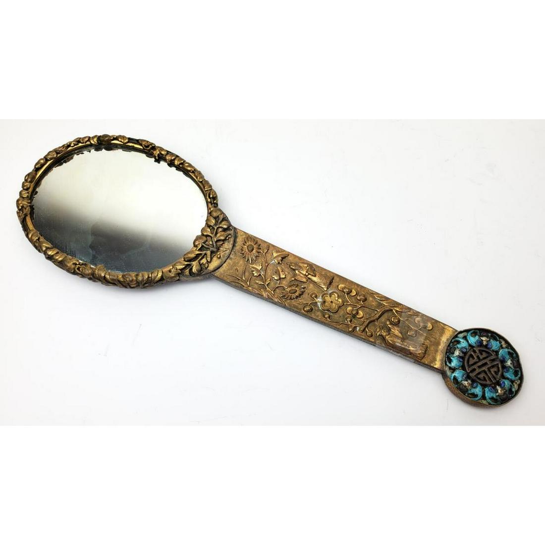 Antique Chinese Silver and Enamel on Brass Mirror: Antique Chinese Silver and Enamel on Brass Mirror. With decorations of flowers, birds and people.Condition: Generally Good. One small element missing.Dimensions: H- 12.5", W- 4".Provenance: From a Que