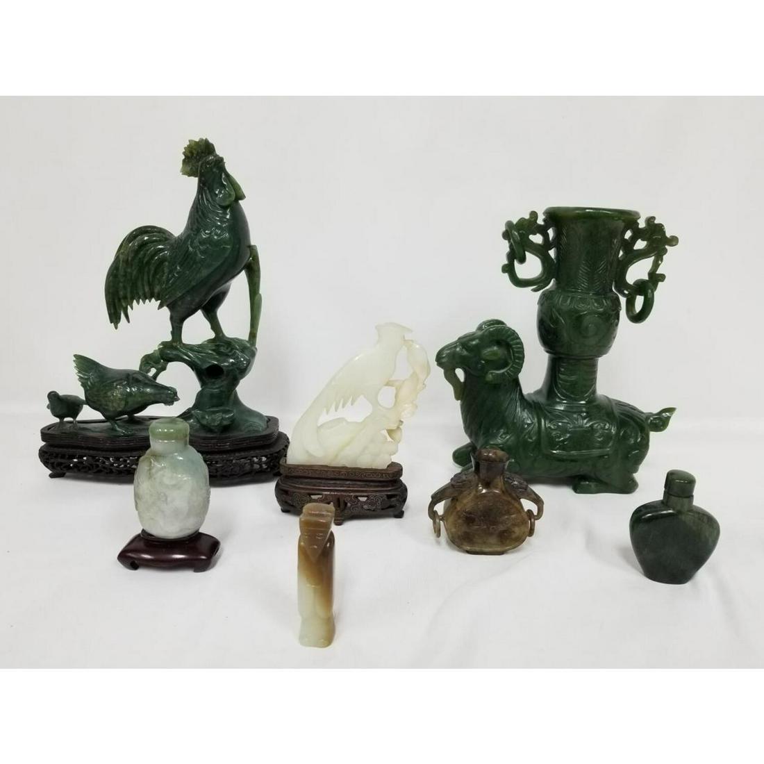 Chinese Lot of 7 Jade, Jadite Items: Chinese Lot of 7 Jade, Jadeite & Hardstone Items Including 4 Figures and 3 Snuff Bottles. Some on Wooden Bases. Condition: Generally Good. Dimensions: H- 8.25". Provenance: From a Long Island, NY Home