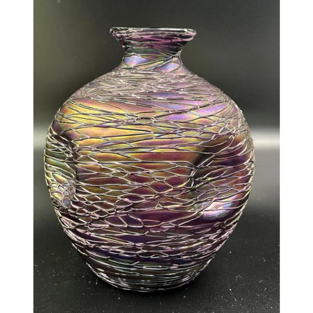 Loetz Style Purple Threaded Art Glass Vase: Loetz Style Purple Threaded Art Glass Iridescent Vase. Condition: Generally Very Good. Dimensions: H- 6.5", Dia- 5". Provenance: From a Long Island, NY Home. Please note the absence of a Condition Rep