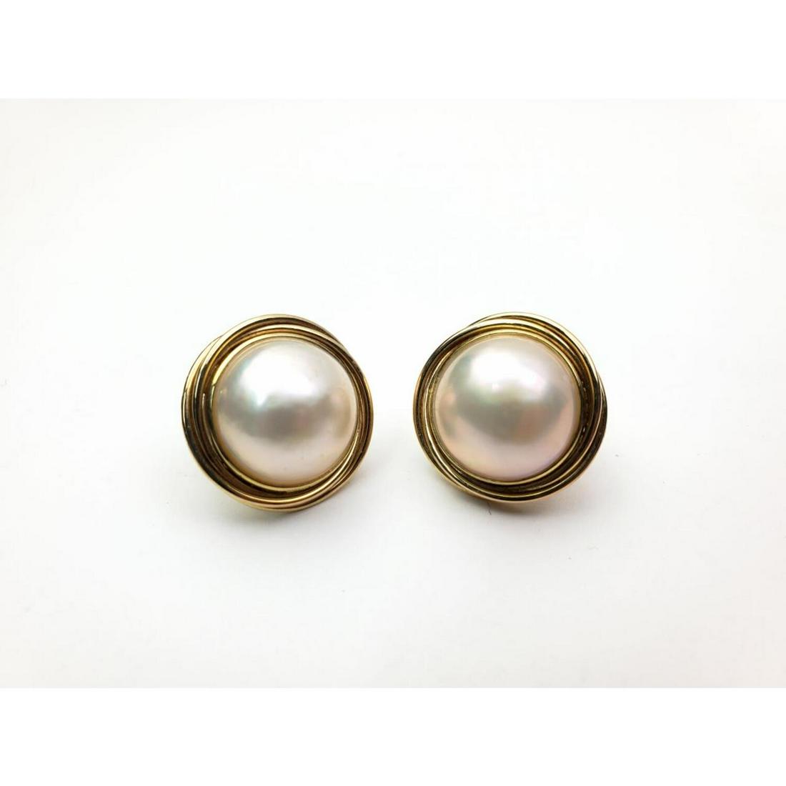Pair of 14K Gold and Moby Pearls Earrings: Pair of 14K Gold and Moby Pearls Earrings. Condition: Excellent. Dimensions: Dia- 1.75". Weight: 8.6 dwt / 13.4g. Provenance: From a Long Island, NY Estate. Please note the absence of a Condition Repo