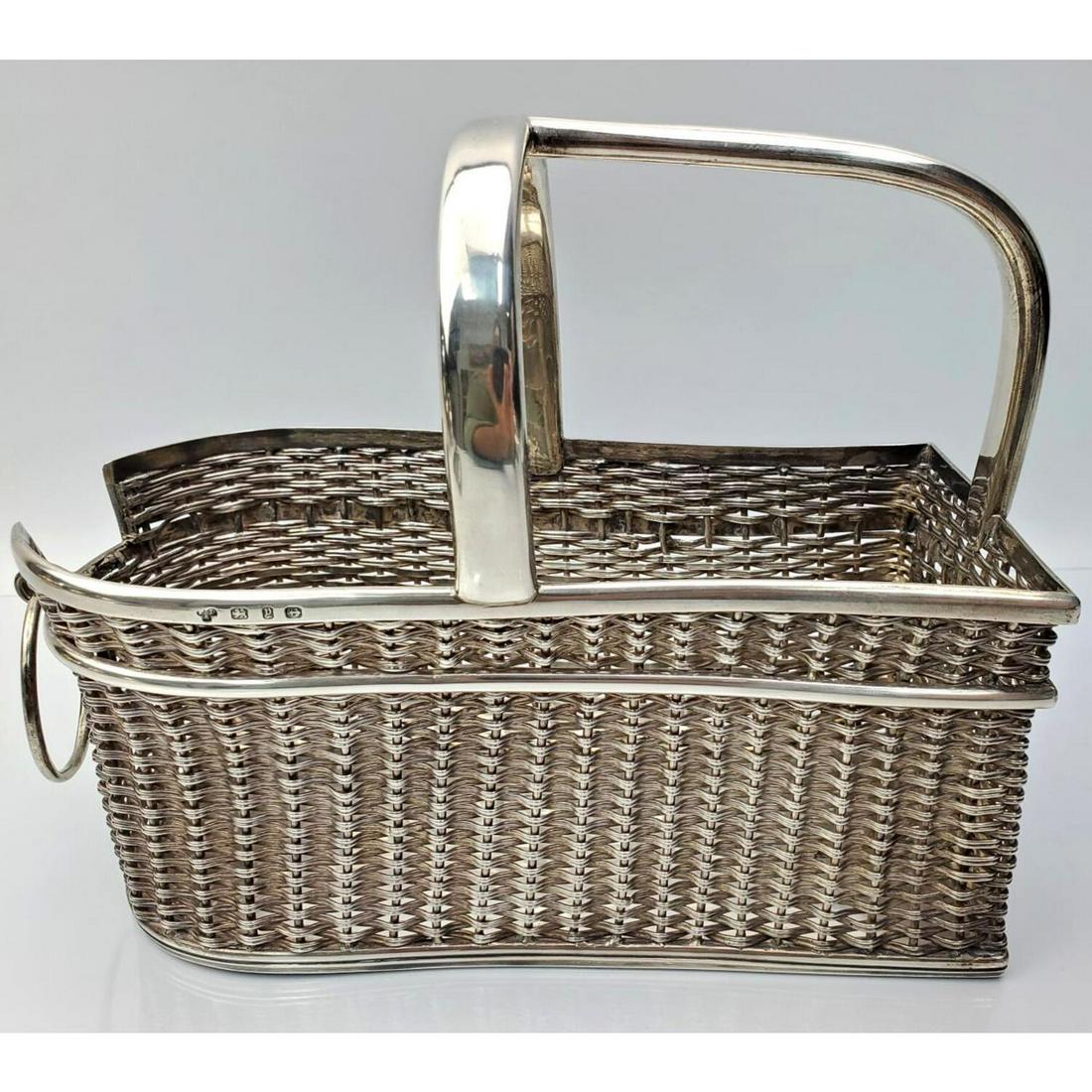Heavy English Sterling Silver Wine Bottle Caddy: Heavy English Sterling Silver Wine Bottle Caddy With Basket Weave Design. Fully Hallmarked. Retailed by Tiffany & Co. London. Condition: Excellent. Dimensions: 9" x 4" x 7.5". Weight: 36ozt / 1121g. P
