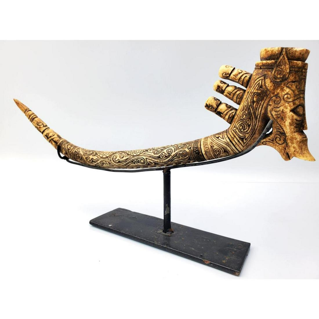 Indonesian Batak Carved Antler: Indonesian Batak Carved Antler Mounted on a Display Base. Condition: Generally Good; As Found.Dimensions: L-14" x H-7" (Including Metal Stand).Provenance: From a Long Island, NY Private Collector.Plea