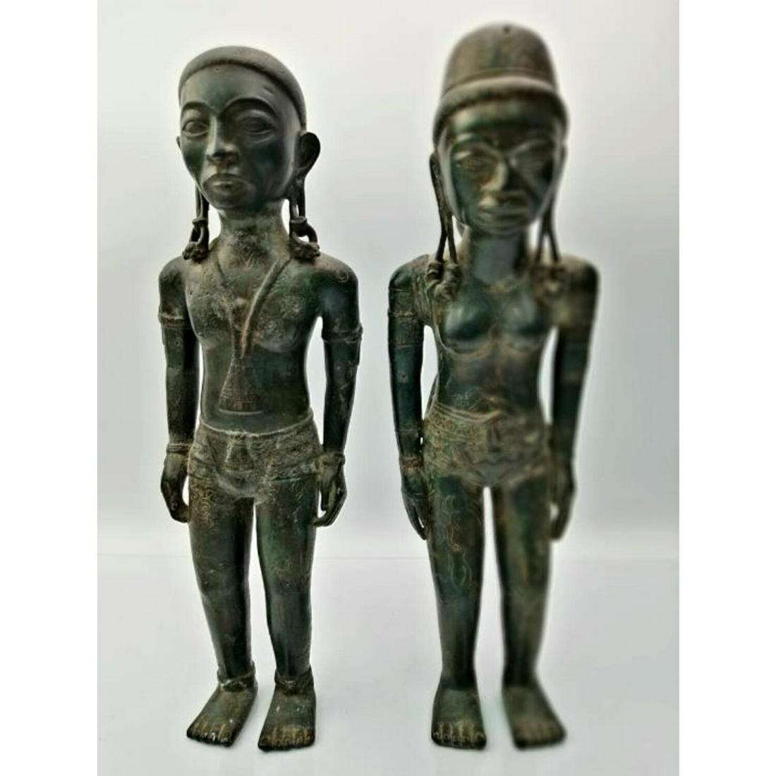 Pair of Indonesian Outer Island Bronze Figures: Pair of Indonesian Outer Island Bronze Figures of a Man and Woman with Child. Condition: Excellent, However there is Large Amount of Oxidation on Both Items. Dimensions: H- 13.5". Provenance: From a L