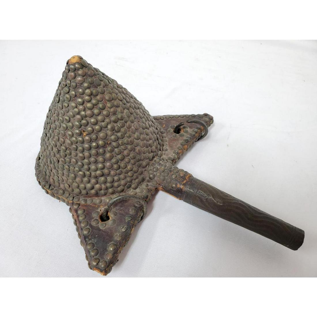 Antique African Leather, Wood, and Metal Item: Antique African Leather, Wood, and Metal Item. Condition: As Is. Dimensions: L- 12", W- 10", H- 5.5". Provenance: From a Long Island, NY Home. Please note the absence of a Condition Report does not im