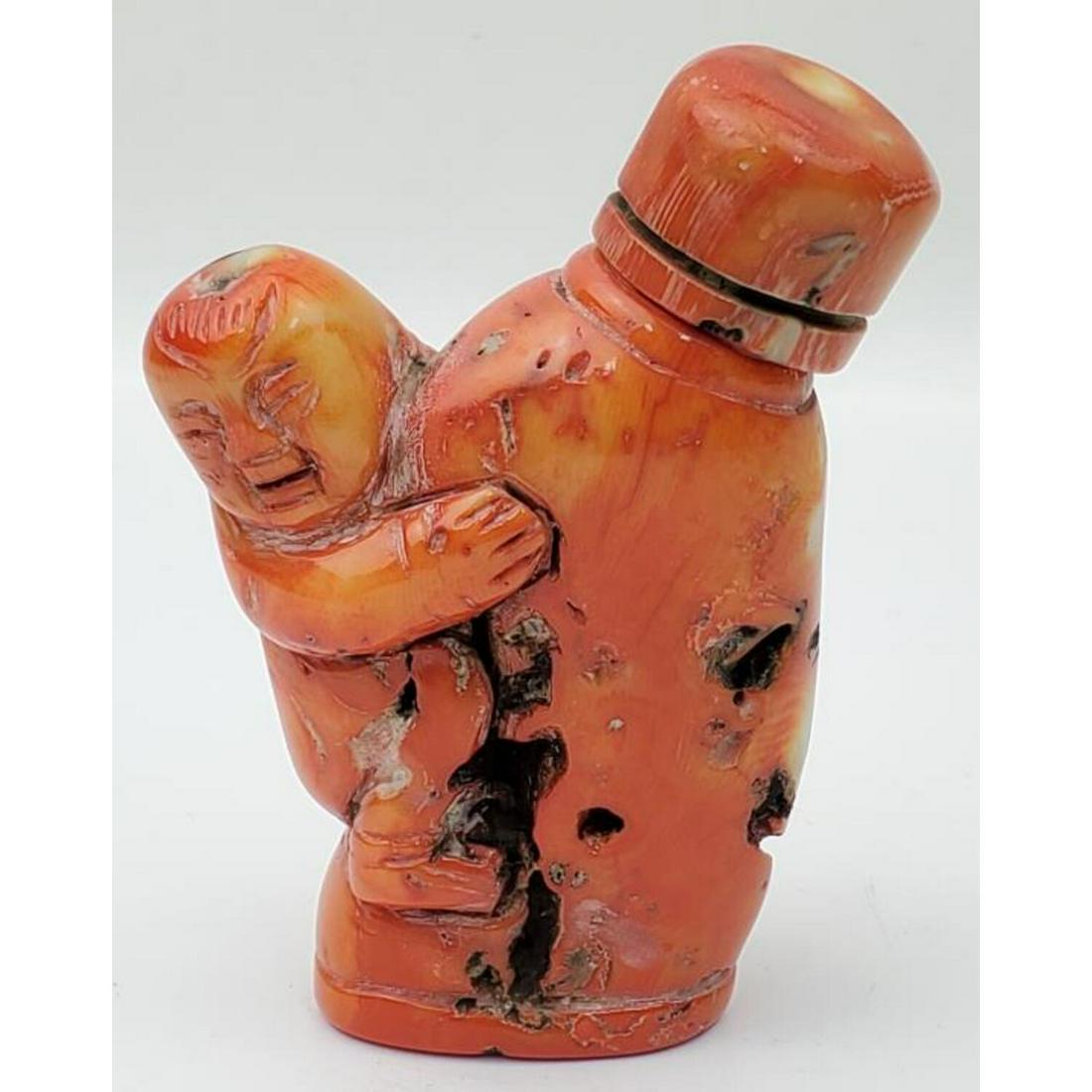Chinese Carved Coral Snuff Bottle: Chinese Carved Coral Snuff Bottle. Condition: Generally Good. Dimensions: H- 3.25", W- 2.5". Provenance: From a Long Island, NY Home. Please note the absence of a Condition Report does not imply that 