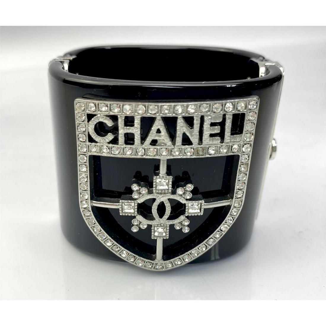 Rare Chanel Vintage Black Resin & Metal Bracelet: Rare Chanel Vintage Black Resin and Metal Bracelet. In Original Chanel Box. Condition: Excellent. Dimension: Dia- 2". Total Weight: 115.2g. Provenance: From a Long Island, NY Home. Please note the abs