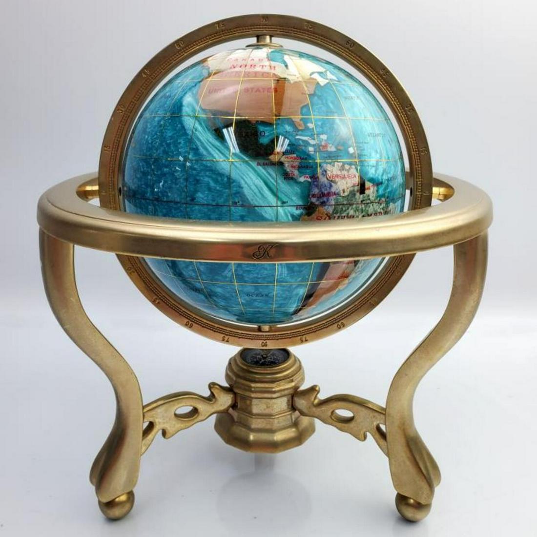 Brass Globe with Inlay Stones & Compass: Brass Globe with Inlay Stones & Compass. Condition: Generally Very Good. Dimensions: Diameter - 8.50", Height - 10". Provenance: Long Island Estate. Please note the absence of a Condition Report does 