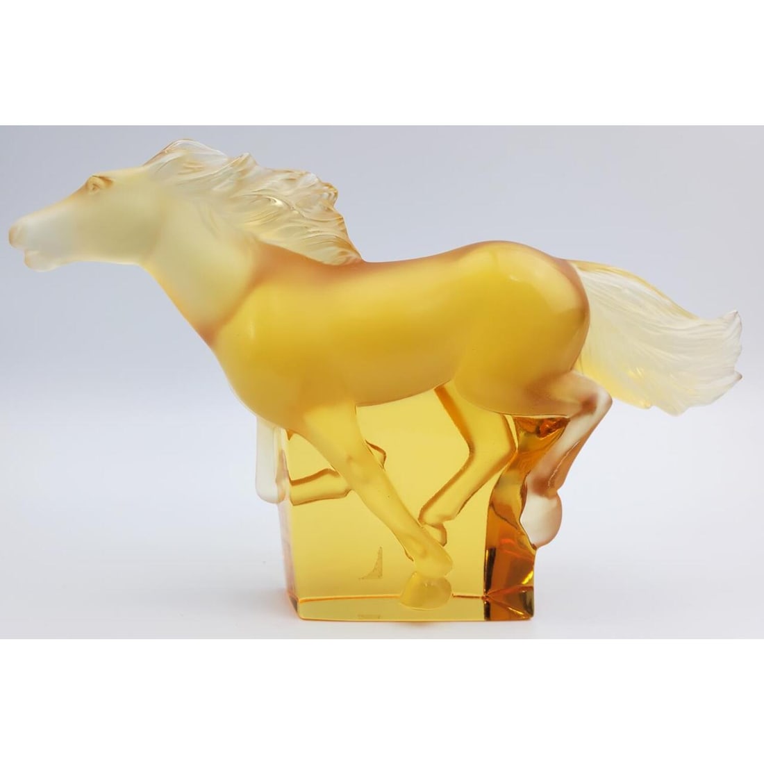 Lalique France â€œKazak" Amber Color Glass Horse: Lalique France â€œKazak” Amber Color Glass Figure of a Horse. Fully Signed. Condition: Excellent without any Chips, Cracks, Repairs, or Damages. Dimensions: L- 7.5", H- 4.25". Provenance: Fr