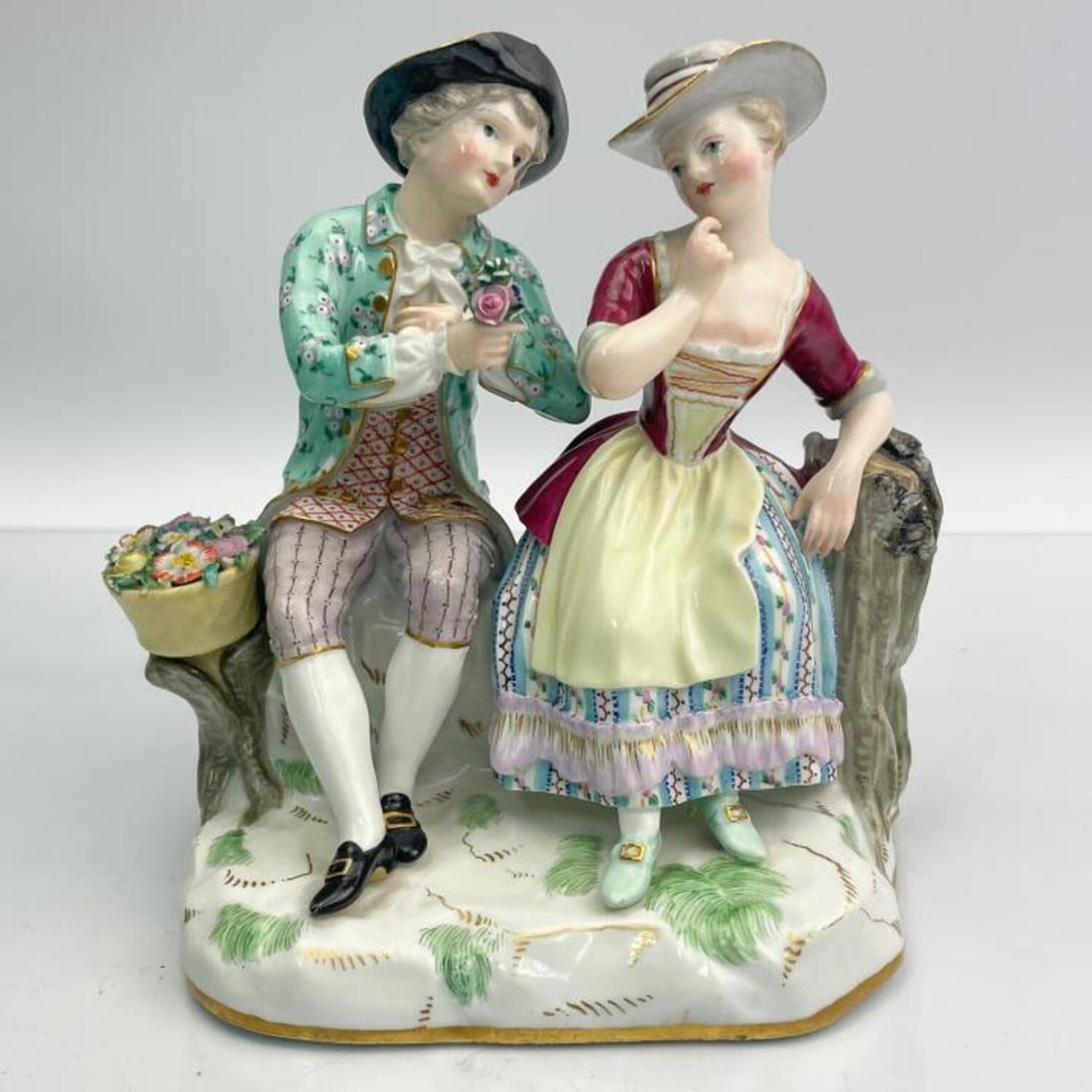 Antique 19th C. Meissen Porcelain Figure of Couple: Antique 19th Century Meissen Porcelain Figure of a Couple Courting Scene. Condition: Generally Good, Firing Crack on the Bottom and Chip on Lady's Hat. Dimensions: L- 6" x W- 4" x H- 5.25". Provenance
