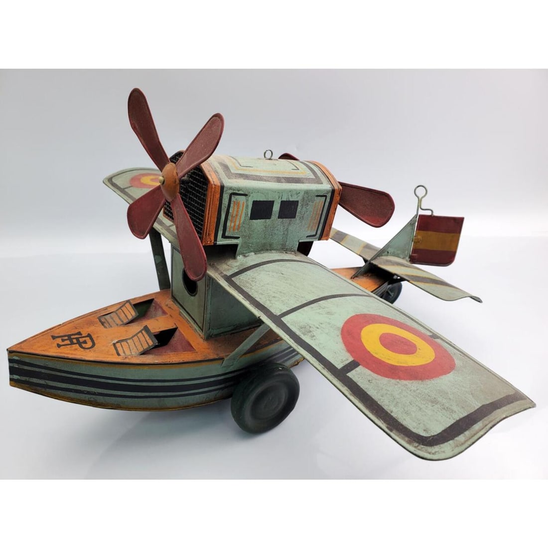 Vintage Metal Seaplane Toy w/ Moving Wheels: Vintage Metal Seaplane Toy w/ Moving Wheels and Propellers. Condition: Generally Good. Dirty. Some Dents & Losses Due to Age. Sold As Is. Dimensions: L-16" x W-15" x H-10".Provenance: From a Long Isla