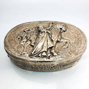 Antique German 800 Silver Covered Box: Antique German 800 Silver Covered Box Depicting a Lady with a Horse with German Writing. Fully Hallmarked. Condition: Generally Good with Tarnish. Dimensions: L- 7.5" x W- 5.5" x H- 2". Total Weight: