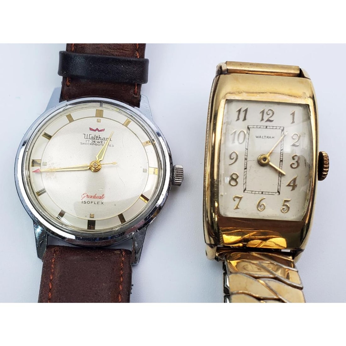 Lot of 2 Old Waltham Old Watches: Lot of 2 Old Waltham Old Watches Including 1 Graduate Isoflex, 17 Jewel & Another. Condition: Generally Good, However, We Do Not Guarantee the Workability of Any Used Watches.Dimensions: Largest Face-