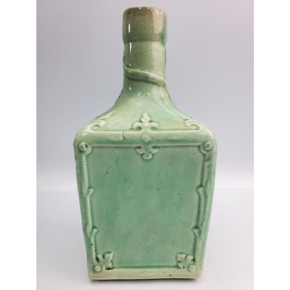 Chinese Celadon Porcelain Bottle: Chinese Celadon Porcelain Bottle. Condition: Generally Very Good. Dimensions: H- 9" x W- 4". Provenance: From a Manhattan Apartment, New York. Please note the absence of a Condition Report does not im