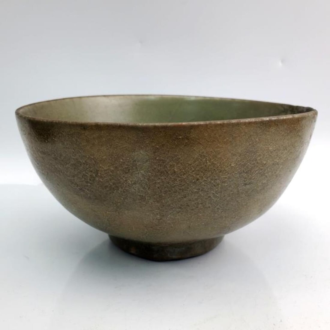 Antique Chinese Sung Dynasty Celadon Bowl.: Antique Chinese Sung Dynasty Celadon Bowl. Condition: Large Old Repair at the Rim. Dimensions: H-3.5" x Dia-7".Provenance: From a Long Island, NY Home. Please note the absence of a Condition Report do