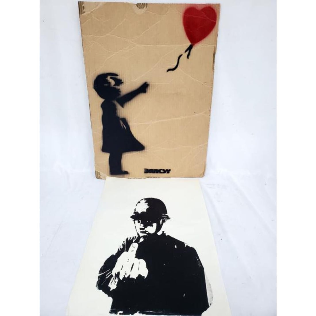 After Banksy Large Spray Paint on Cardboard: After & Attributed to Banksy, British, Large Spray Paint on Cardboard from "Dismaland" Exhibit. Signed at the Bottom in Spray Paint & On The Back in Marker. Numbered 4/10 on the Back. Along w/ an Unsi