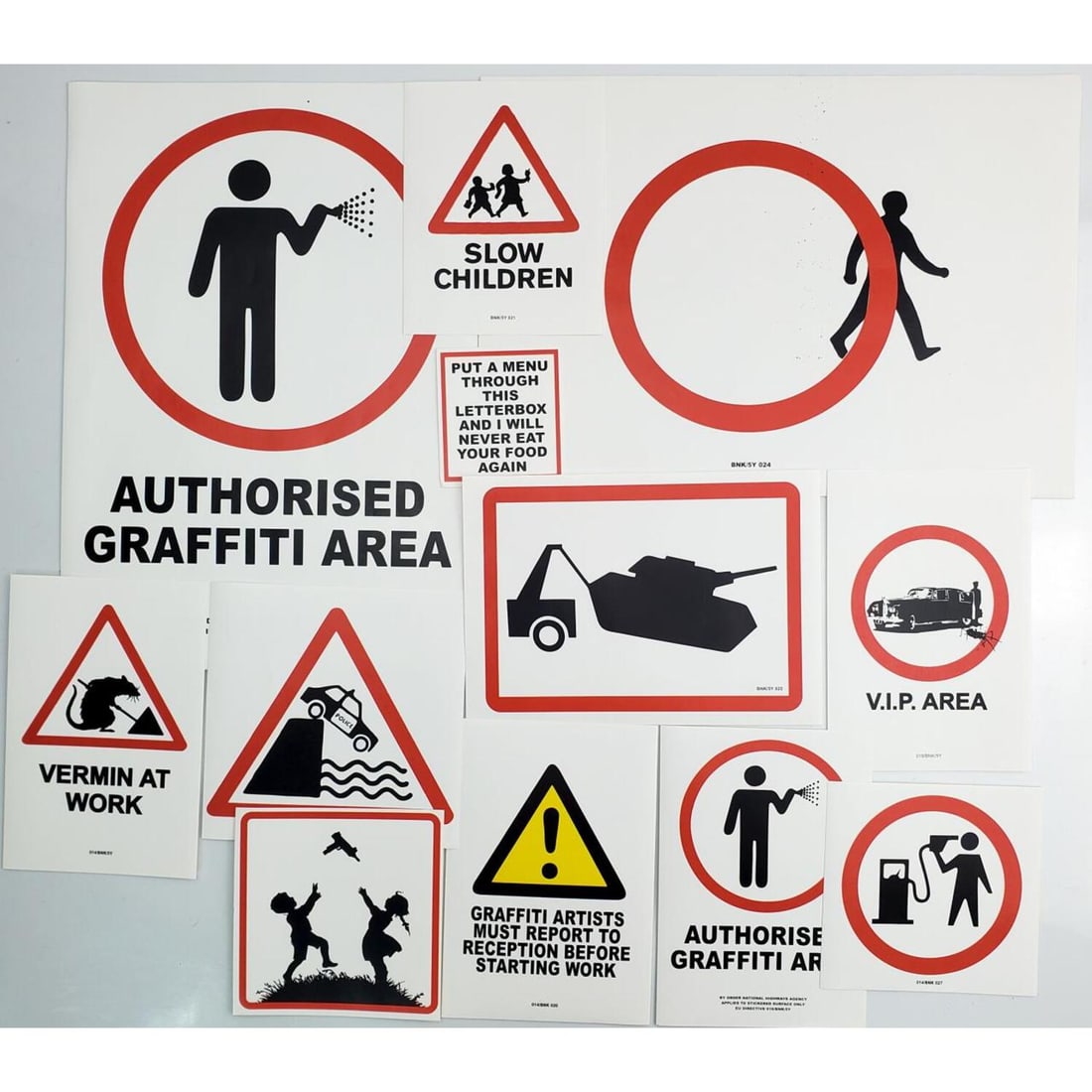 After Banksy Lot of 12 Stickers; "Petrol Head": After & Attributed to Banksy, British Lot of 12 Stickers Designed by Banksy Including "Petrol Head", "Towing Tank" & "Graffiti Artists Must Report to Reception" & Others. We Do Not Guarantee the Authe