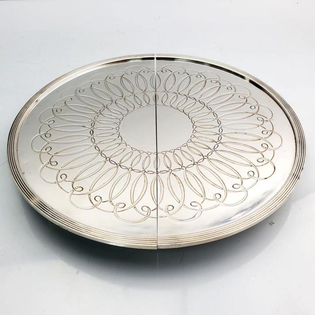 Antique Gallia Cristofle France Cake Stand: Antique Gallia Cristofle France Extendable Cake Stand w/ Rolling Mechanism w/ Wheels. Condition: Very Good. Dimensions: Dia-9.5". L-14.4" (Fully Extended). Provenance: From a Long Island, NY Home. Ple