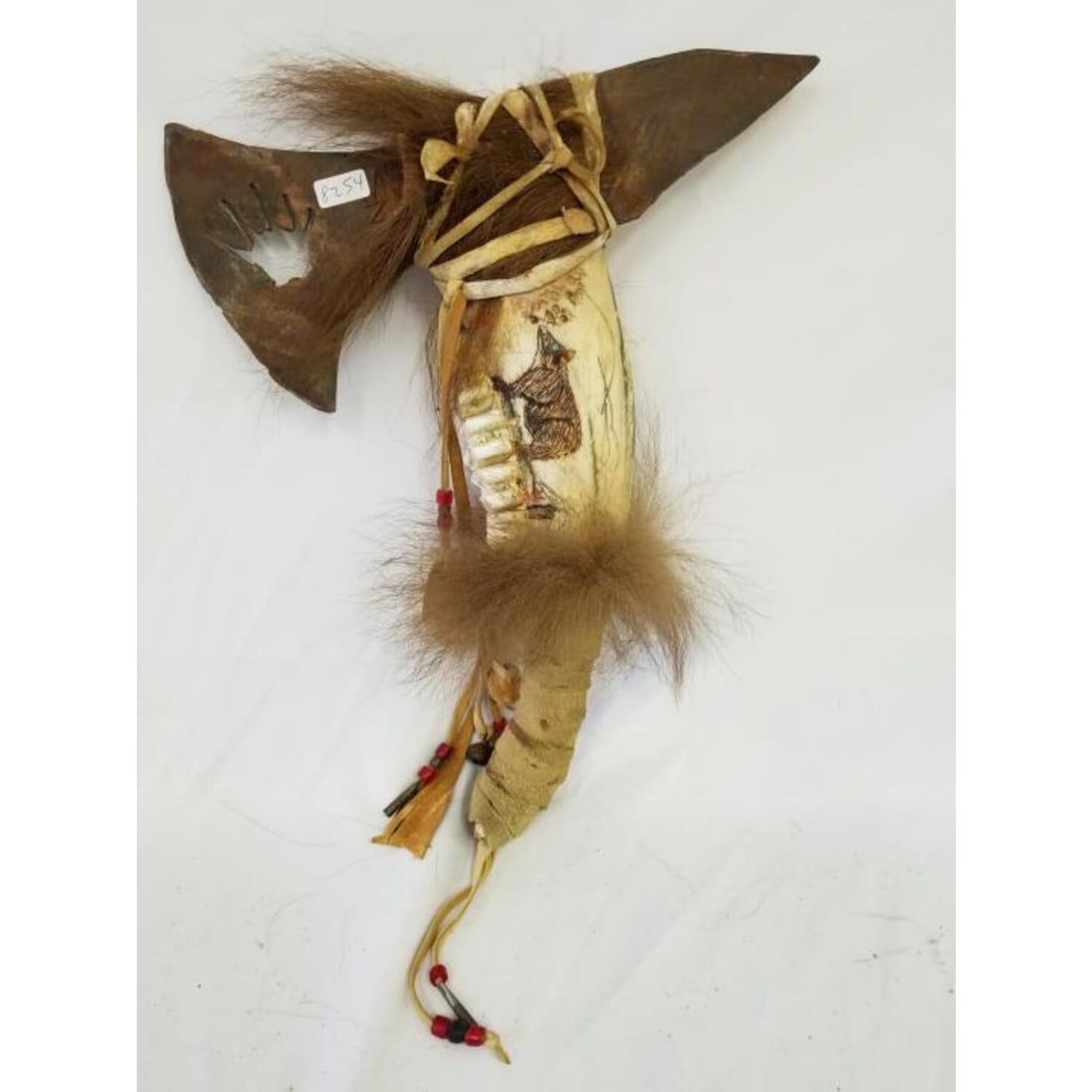 Vintage Native American Axe Made From Carved Tooth: Vintage Native American Axe Made From Carved Animal Tooth & Iron. Condition: Generally Good for Age. Dimensions: H- 14.5" x W- 10.5". Provenance: From an Upstate, NY Estate.Please note the absence of 