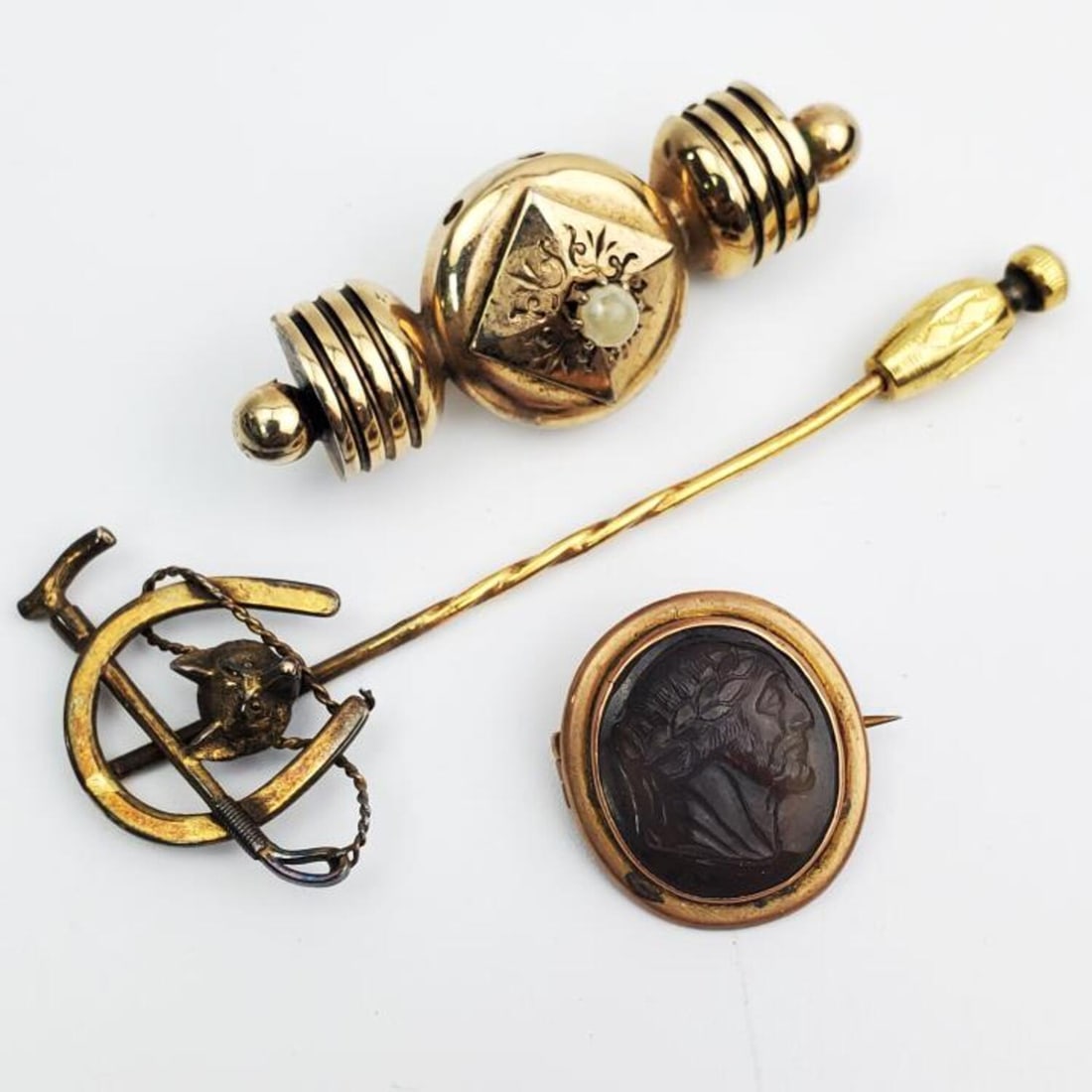 Lot of 3 Antique Gold Filled Jewelry Pins: Lot of 3 Antique Gold Filled Jewelry Pins. 1 w/ Carved Agate Stone of a Roman. Condition: Generally Good, AS FOUND. Dimensions: Longest-L-3". Provenance: From a Long Island, NY Home. Please note the a