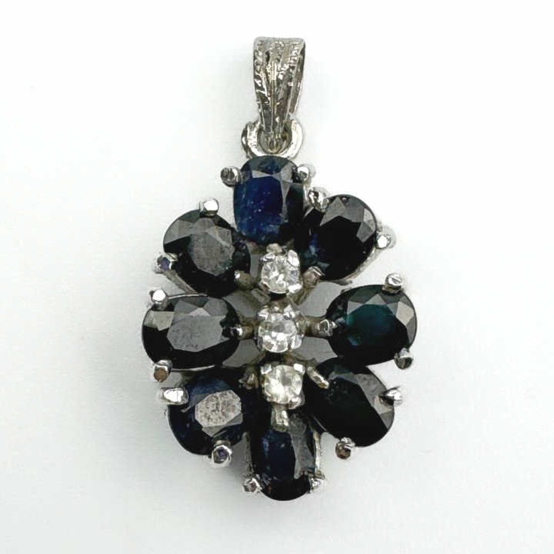 Platinum, Diamonds, and Probably Sapphires Pendant: Platinum, Diamonds, and Probably Sapphires Pendant. Condition: Excellent. Dimensions: 1" x 0.6". Weight: 3.2g / 2dwt. Provenance: From a Long Island, NY Home. Please note the absence of a Condition Re