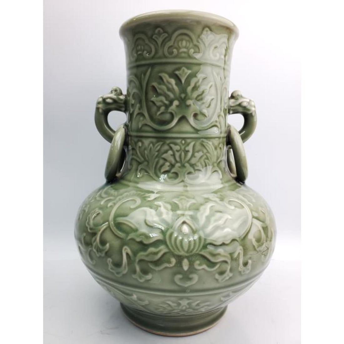 Chinese Celadon Porcelain Vase, Drilled for a Lamp: Chinese Celadon Porcelain Vase. Drilled for a Lamp. Condition: Porcelain- Excellent. Wood Mount- Needs Attention. Dimensions: H- 11.75 " x Dia- 8.5". Provenance: From a Long Island, NY Home. Please no