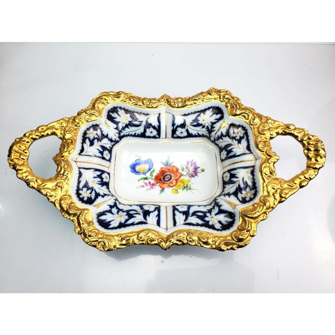 Antique Meissen Porcelain Hand Painted Bowl: Antique Meissen Porcelain Hand Painted & Heavily Gilt Decorated 2 Handle Bowl. Condition: Excellent. Dimensions: Total L-14" x W-8" x H-3.25". Provenance: From a Long Island, NY Home. Please note the 