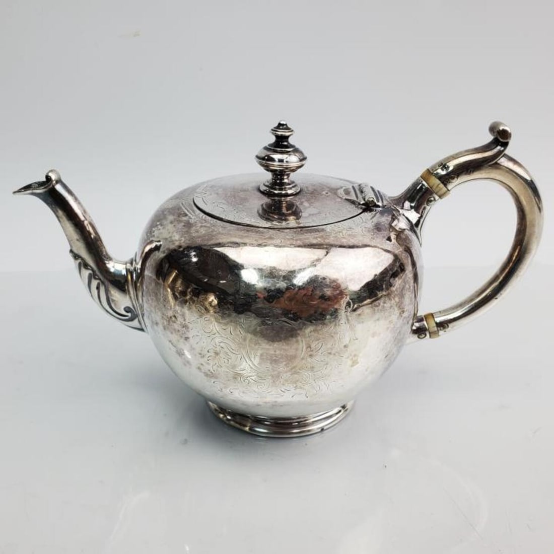 English Victorian Sterling Silver Saffron Tea Pot: English Victorian Sterling Silver Saffron Tea Pot by Charles Fox, London. Circa 1855. Has Engraved Armorials. Fully Hallmarked. Condition: Generally Very Good. Dimensions: H- 4" x Handle to Spout- 6.6