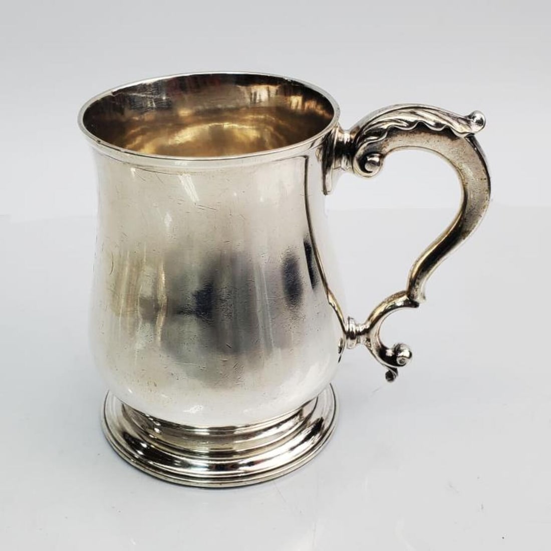 English George III Sterling Silver Cann 1770: English George III Sterling Silver Cann by William Bayley, London. Circa 1770. Fully Hallmarked. Condition: Generally Very Good with Armorial Period Monogram. Dimensions: H 3.75" x Base Dia- 2.75". We