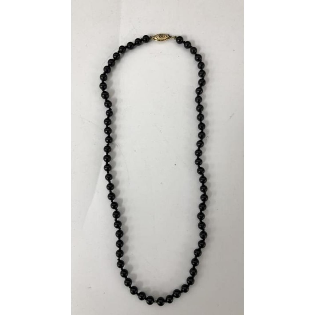 14K Gold & Black Onyx Choker Necklace: 14K Gold & Black Onyx Choker Necklace. Condition: Excellent. Dimensions: L- 16". Total Weight: 10.7g. Provenance: From a Long Island, NY Home. Please note the absence of a Condition Report does not im