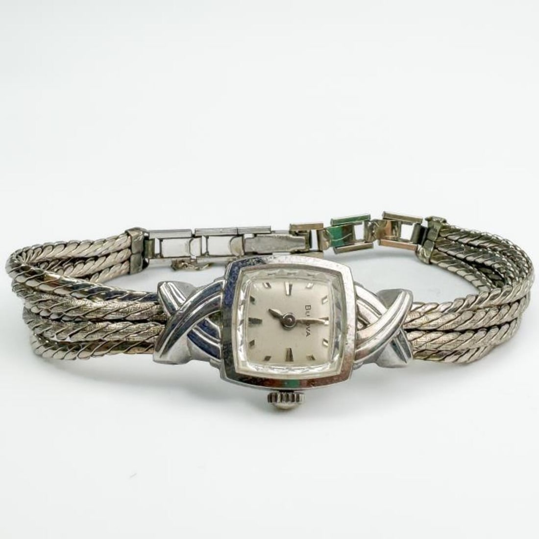 Vintage Bulova 10K White Gold Ladies Watch: Vintage Bulova 10K White Gold Ladies Watch w/ Original Gold Filled Band. Condition: Generally Good, However, We Do Not Guarantee the Workability of Used Watches. Dimensions: Face-0.7" x 0.7". Provenan