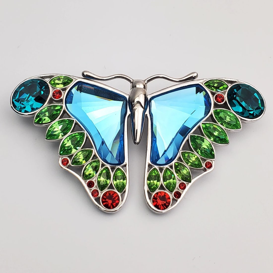 Rare Swarovski Crystal Sterling Silver Butterfly: Rare Swarovski Crystal Sterling Silver & Colored Glass Butterfly Pin. Fully Hallmarked. Condition: Excellent. Dimensions: 2.5" x 1.4". Gross Weight: 28.9g. Provenance: From a Long Island, NY Home. Ple