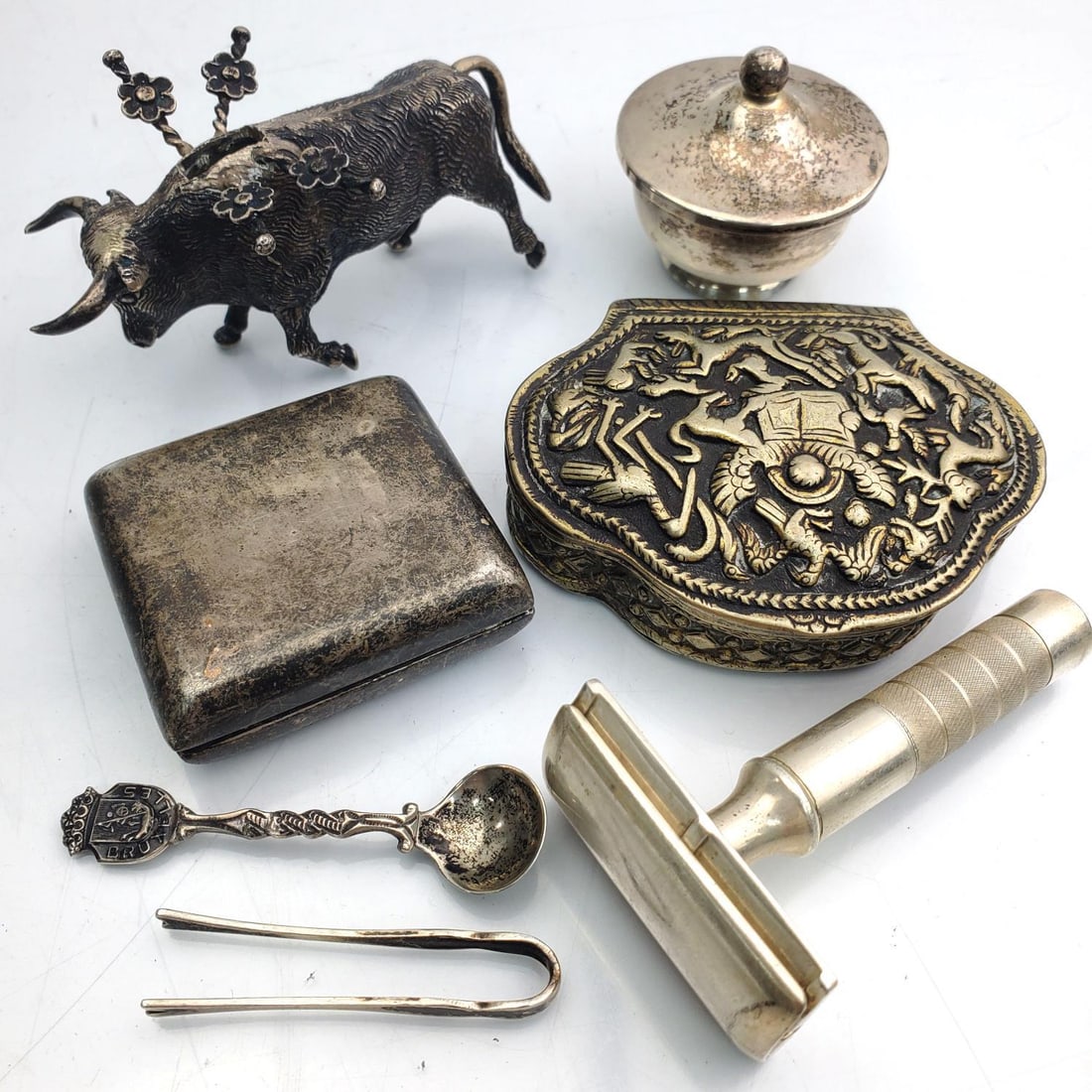 Lot of 8 Sterling Silver and Silver Items: Lot of 8 Sterling Silver and Silver Items Including a Figure of a Bull, a Toothpick Holder, a Sterling Silver Safety Razor, a Small Trinket Box, a Pill Box and an Old Box along with Two Other Items. C